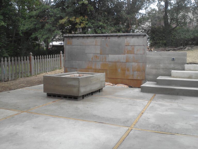 as Backyard firepit and feature wall (waterfall)